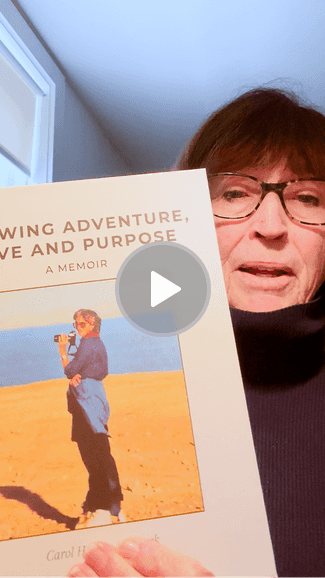Carol holding her memoir